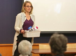 Maria La France of Des Moines holds a basket of her epileptic son's medications as she gives a testimony during a forum about medical cannabis at the Iowa City Public Library in Iowa City on Tuesday, November 19, 2013. 